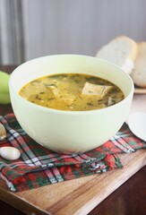 bowl of soup with bread and garlic