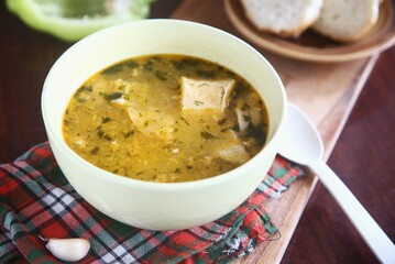 bowl of yummy soup with bread and garlic