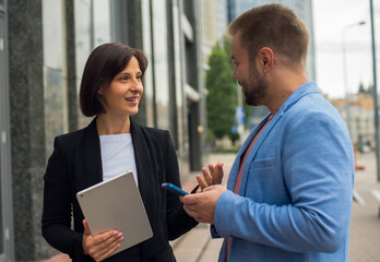 colleagues communicate and discuss on the street