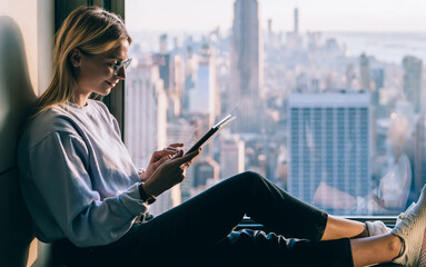 Female tourist enjoying roaming internet connection while travel to NYC