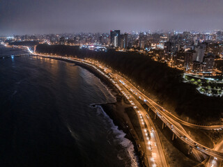 Fototapeta na wymiar Aerial panoramic view of buildings in Miraflores and Barranco district in Lima. Night.