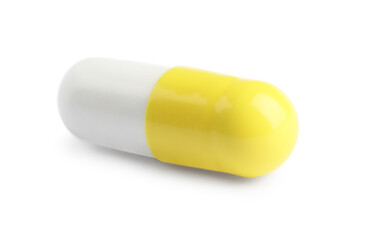 One pill on white background. Medicinal treatment
