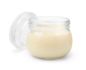 Obraz na płótnie Canvas Open jar with condensed milk isolated on white