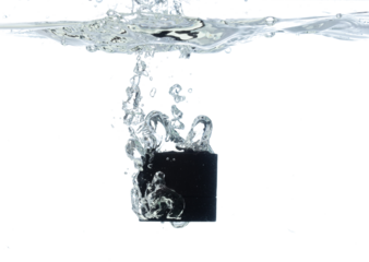 Black Cosmetic container fall into clear water with air bubble. Cosmetic treatment container drop to clear water of freshness. White background isolated freeze element