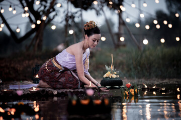 Thai woman wearing thai traditional dresses modern hold kratong pray, Loy Krathong Traditional...