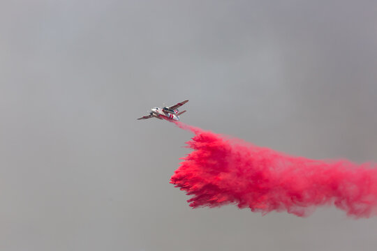 Airplanes dropping phos-check fire retardant on California wild fires