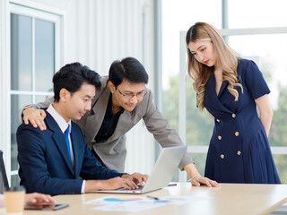 Asian professional successful male female businessmen businesswomen employees staffs in formal business suit outfit sitting standing important job deal done together