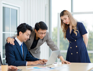 Asian professional successful male female businessmen businesswomen employees staffs in formal business suit outfit sitting standing important job deal done together