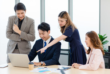 Asian professional successful male female businessmen businesswomen employees staffs in formal business suit outfit sitting standing important job deal done together