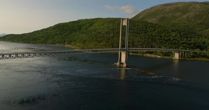 Aerial scenic view of traffic on suspension bridge at Efjord, Norway. Coastal landscape.