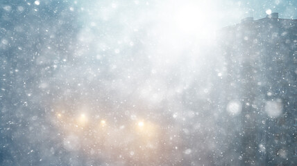 Obraz premium blizzard in the city, abstract blurred light white urban background, snowfall on the background of apartment buildings in the city, silhouette, copy space