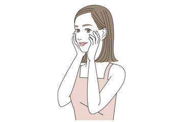 にっこりと笑いながら顔に手をあてている女性