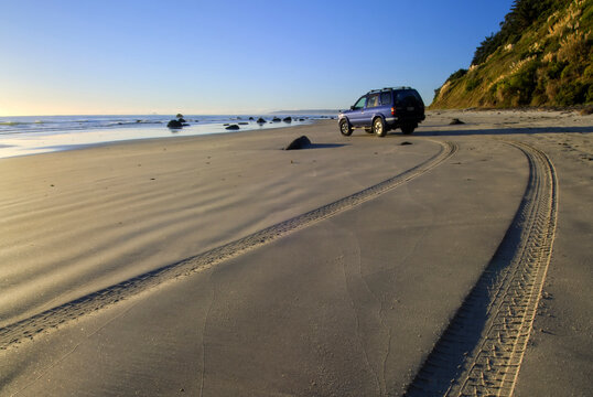 4x4 on Maketu beach at low tide, Bay of Plenty, New Zealand