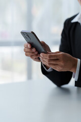 Businesswoman, investor analyzing stock market investment with financial panel, business intelligence on smartphone and laptop computer screen. Focus image. Concept. Technology. Communication.