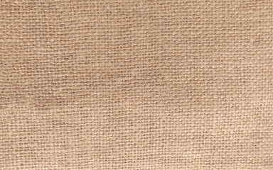 Fototapeta na wymiar beige linen background, fabric texture for fashion design or upholstered furniture