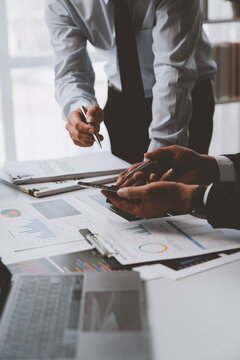Asian male financial officer or accountant checking investment results Financial budget analysis Planning to summarize results and report to the meeting Audit concept and investment results.