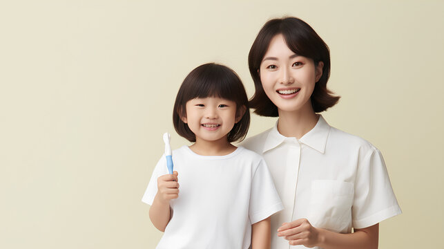 Young Asian mom and daughter brushing their teeth in the room. Oral care.