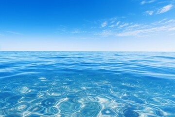 Serene water surface reflecting the colors of a clear blue sky