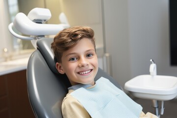 Smiling young boy in dentist chair with a smile on his face.