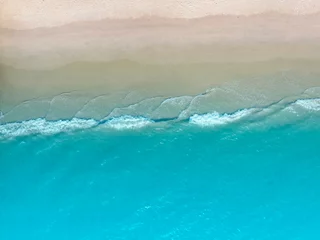 Keuken spatwand met foto Beach Wave water in the Tropical summer beach with  sandy beach background © SASITHORN