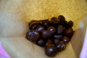 Roasted chestnuts inside a paper bag bought from street vendor