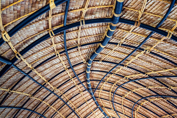 Beautiful thatched roof surface detail of mixed materials pattern structure by weave pile straw...
