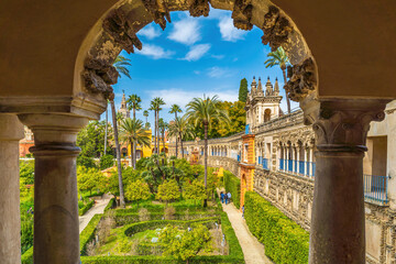 Exterior and garden of Real Alcazar Destination in  Sevilla - obrazy, fototapety, plakaty
