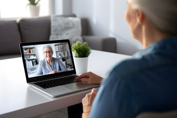 Female doctor therapist consulting older senior patient via virtual video call visit using laptop computer. Digital online healthcare, distance telemedicine. Telehealth videocall - obrazy, fototapety, plakaty