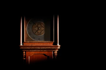 Fotobehang Vintage Close-up of the dial of an antique grandfather clock in a dark room, illuminated by light from the window.  © sv_production