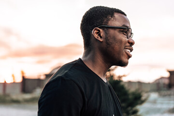 Young african man portrait standing in the street