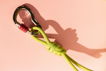 Steel carabiner with clutch. Equipment for climbing and mountaineering. Safety rope. Node eight.