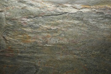 Texture of grey stone surface as background, closeup