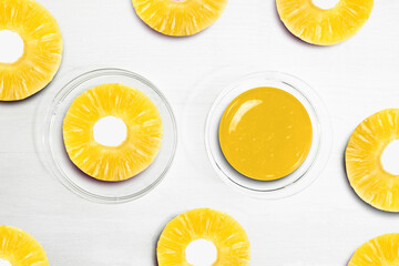 Pineapple Lime Slices. Serum and Pineapple pieces on a white background, beauty.