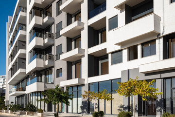 Apartments. Buildings facade exterior with windows, palm trees, real estate property architecture