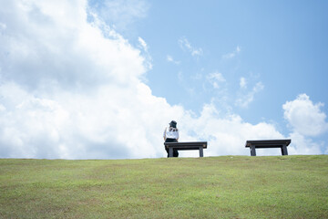 solo woman happy and enjoy with summer travel with cloudy background