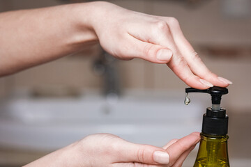 A Hands with soap are washed under the tap with water. Clean from infection and dirt and virus. At...