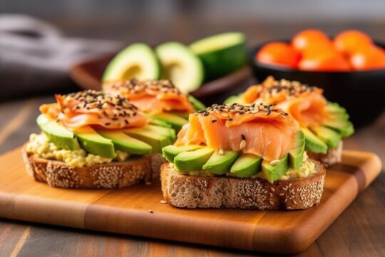 Bagel Halves Topped With Cold Smoked Salmon And Fresh Avocado