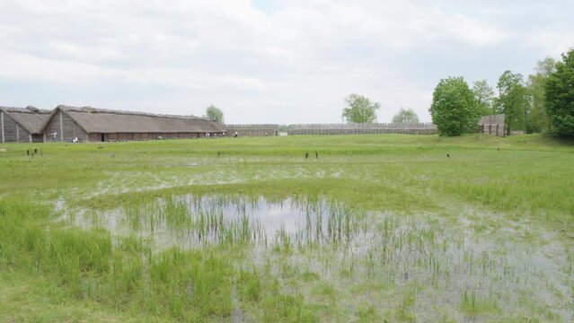 Old Slavic Settlement in Biskupin, Poland - Aerial Pan Left