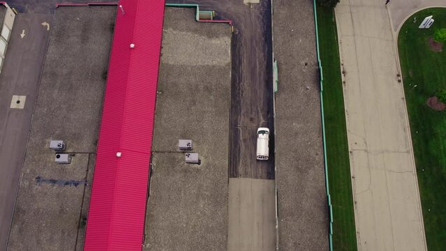 Van after loaded with goods is driving out on a public storage rental facility