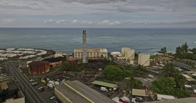 Kahului Maui Hawaii Aerial v4 drone flyover harbor capturing cruise ship, container terminals at Hobron point, shipyard and townscape against dark cloudy sky - Shot with Mavic 3 Cine - December 2022