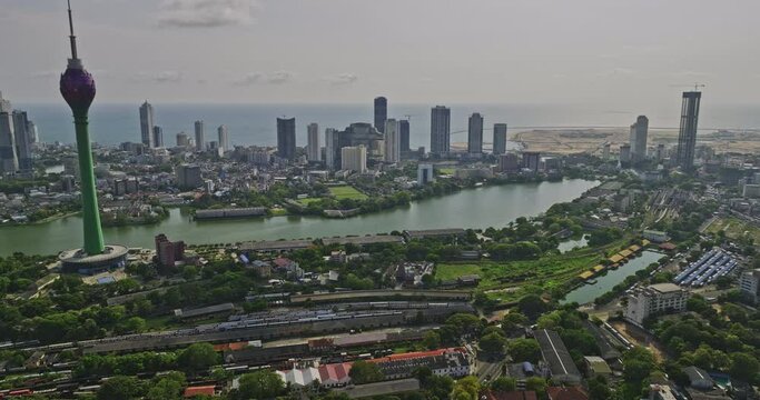 Colombo Sri Lanka Aerial v6 drone flyover Area 10 capturing downtown cityscape across central neighborhoods, main station train yard and Lotus tower at Beira lake - Shot with Mavic 3 Cine - April 2023