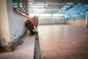 Renovation of the flooring of a terrace which also functions as a roof, creation of a drainage...