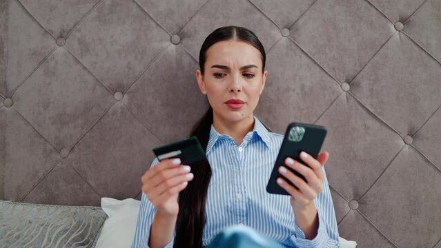 Lady try to pay through e-bank app on cell experiences problems due blocked, card limit, not activated for online payment. Fraud and scam, insufficient lack of funds, unsuccessful transaction, hotel.