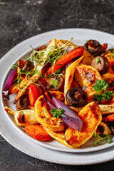 baked winter veggies and mushrooms on a plate