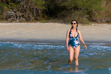 Woman body pretty with swimsuit relax at beach