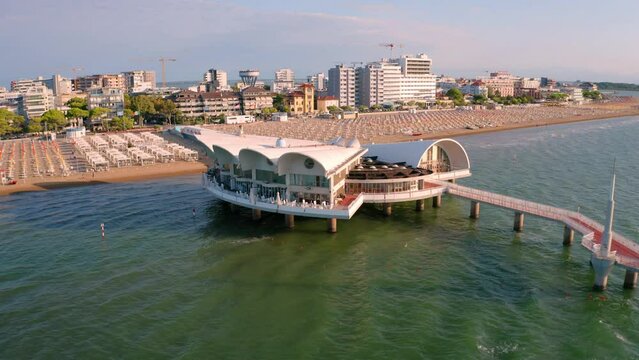 4k drone forward video (Ultra High Definition) of Lignano Sabbiadoro public beach. Picturesque summer scene of Adriatic coast of Italy, Europe. Vacation concept background..