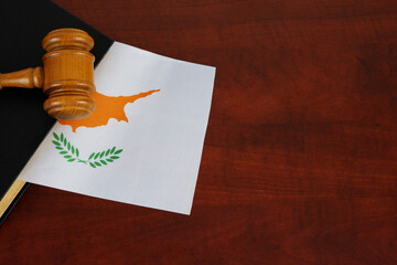 Judge gavel and legal book with  flag of Cyprus. Laws and court in Cyprus.