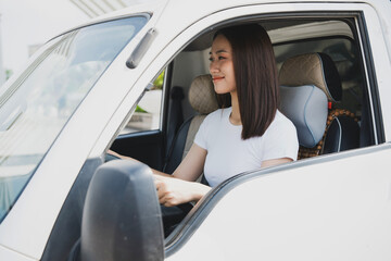 Photo of young Asian woman with her truck