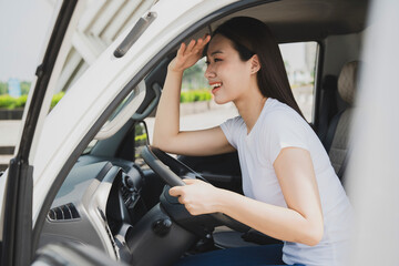 Photo of young Asian woman with her truck