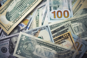 Group of money stack of 100 US dollars banknotes a lot of the background texture. Cash money in a...